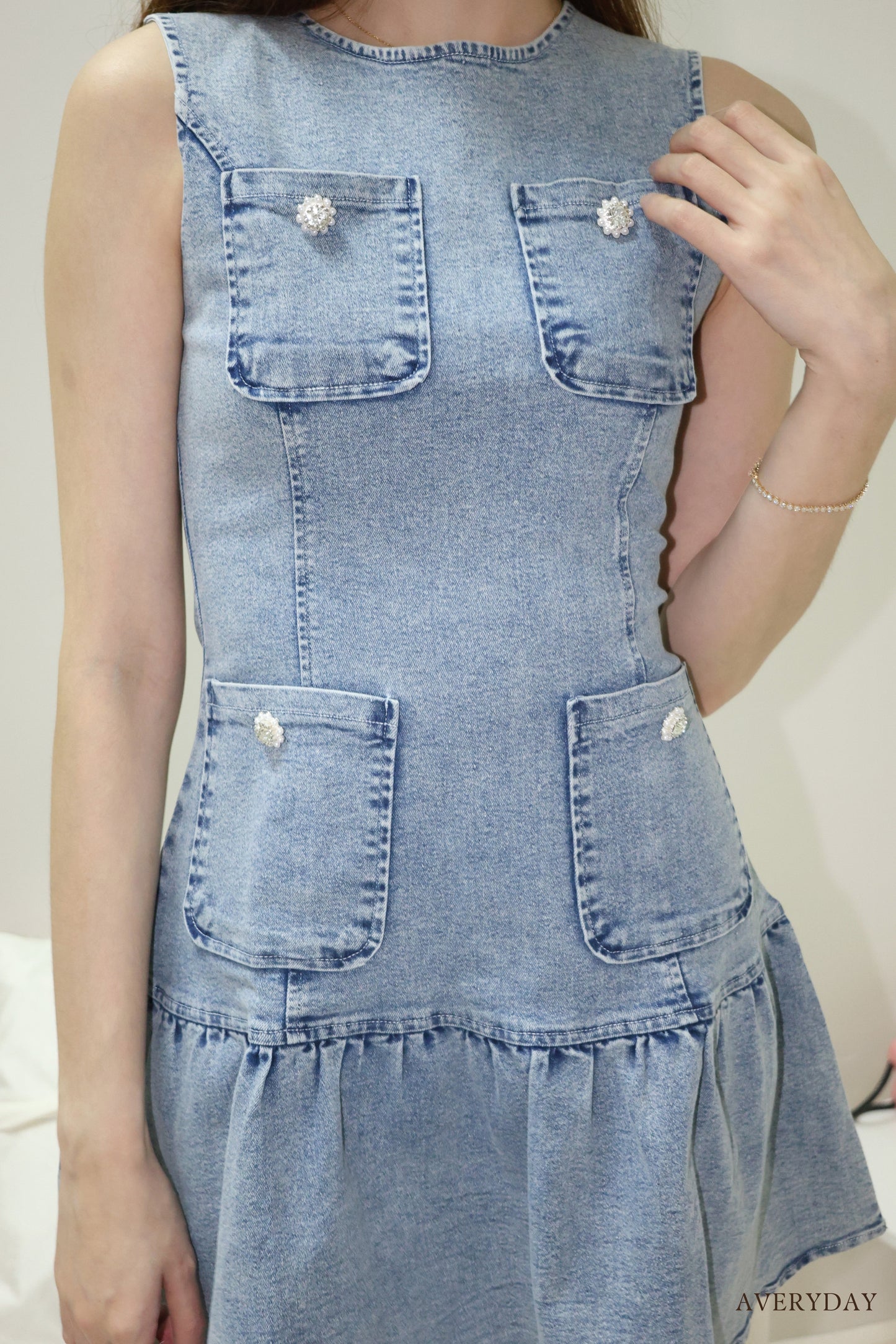 Arabelle denim pearl button pocket dress In Blue Wash