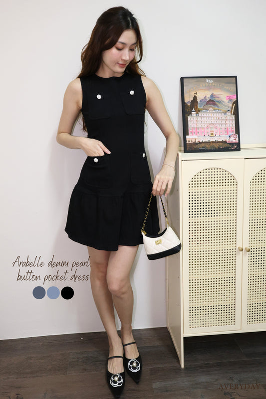 Arabelle denim pearl button pocket dress In Black